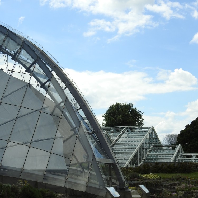 Glass roofs and a beehive at Kew